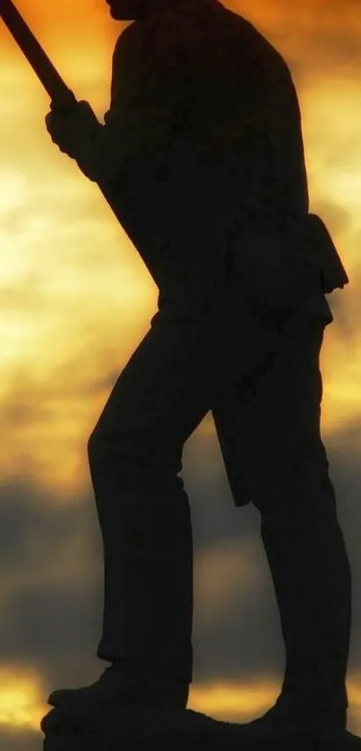 Soldier silhouette in vibrant sunset sky