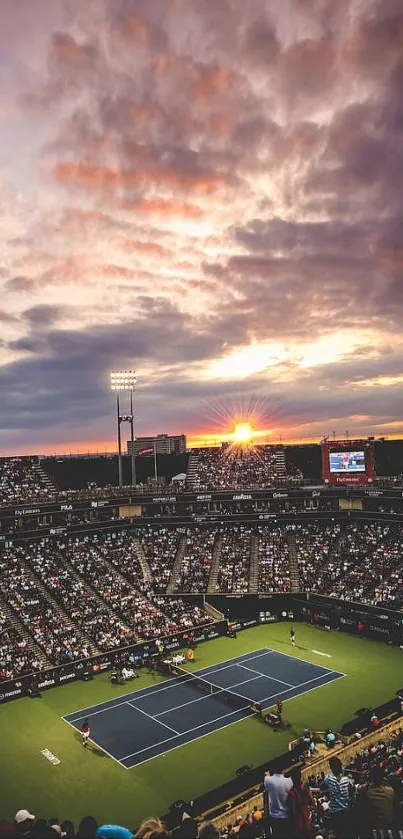 Tennis stadium at sunset with vibrant sky and packed crowd.