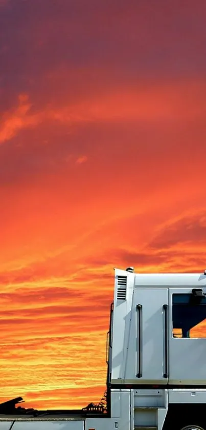 White truck against vivid orange sunset sky, perfect for mobile wallpaper.