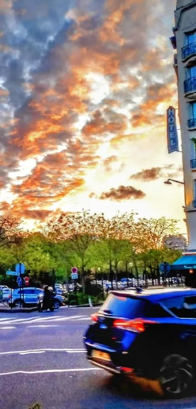 Dynamic city street at sunset with hotel and orange sky.