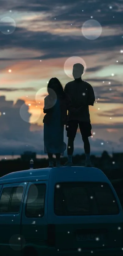 Silhouette of couple on van roof at sunset.