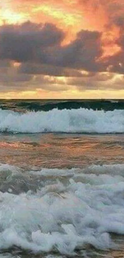 Vibrant sunset over ocean waves with a dramatic sky.