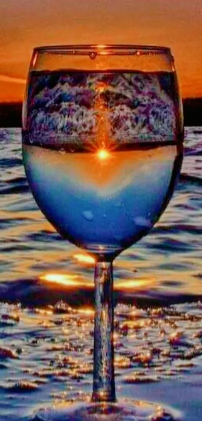 Wine glass reflecting the sunset over an ocean, creating a serene and artistic scene.