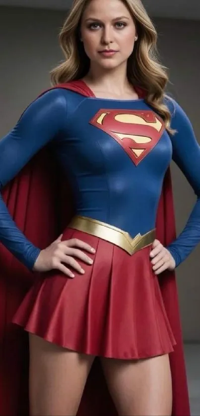 Dynamic female superhero in red and blue suit with cape.