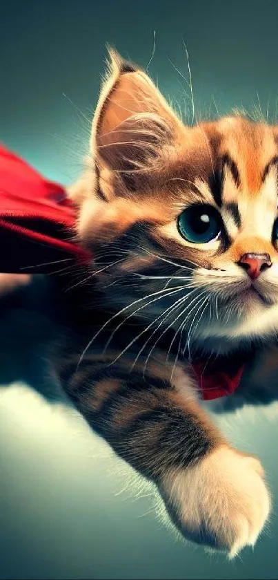 Adorable kitten with a red cape flying like a superhero in a teal background.