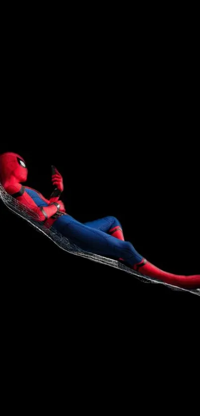 Superhero lounging on web, dynamic wallpaper.