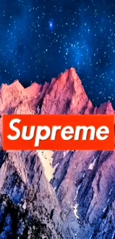 Supreme logo over mountain under starry sky mobile wallpaper.