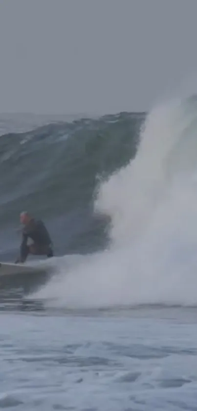 Surfer expertly riding a massive ocean wave with splashing water around.