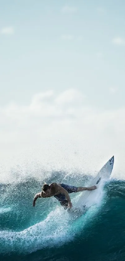 Surfer navigating a vibrant wave under a sunny blue sky.