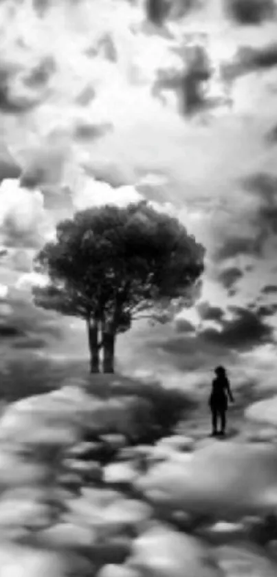 Surreal landscape with tree and person under dramatic clouds in black and white.