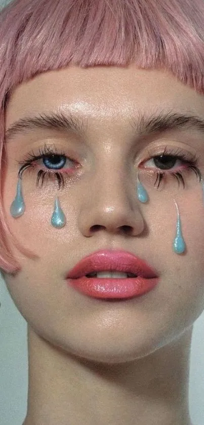 Portrait with pink hair and blue tear-like makeup drops.