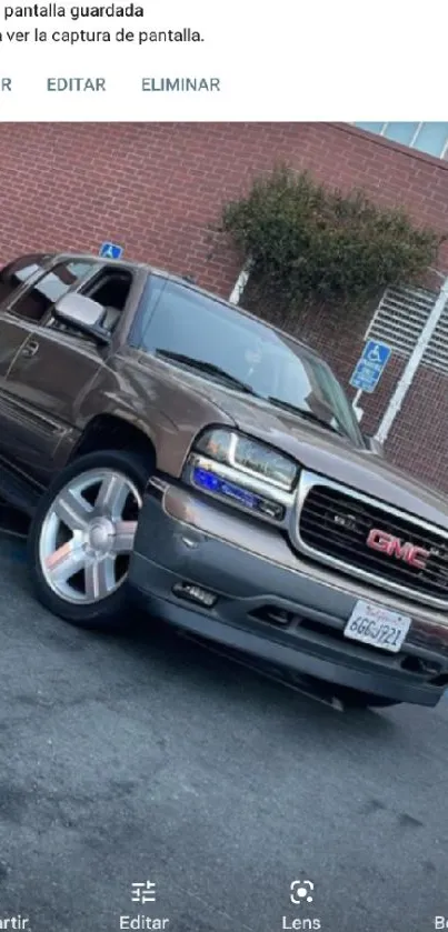 SUV parked in an urban environment with city backdrop.