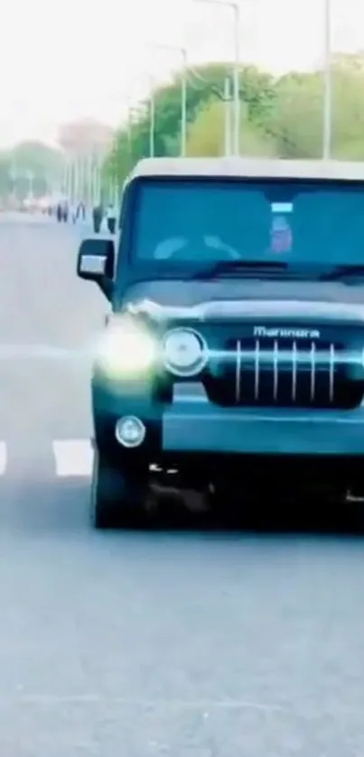 SUV driving on urban road with bright headlights.