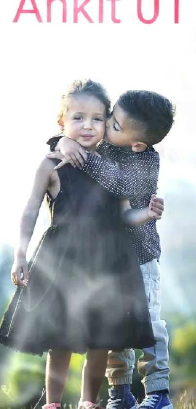 Two children embracing on a scenic green hillside at daytime.