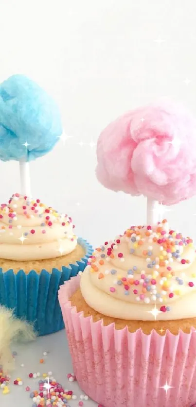 Two cupcakes with cotton candy toppers and sprinkles on a white background.