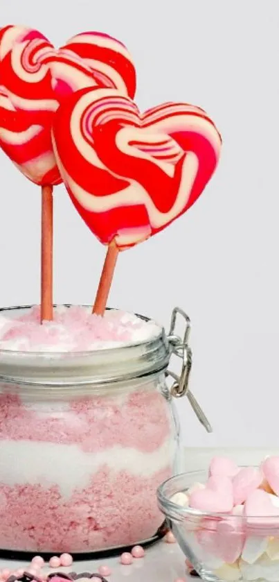 Heart-shaped pink candy lollipops in a jar with sugar.