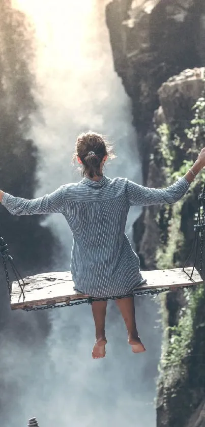 Person swinging over a waterfall amid lush greenery.