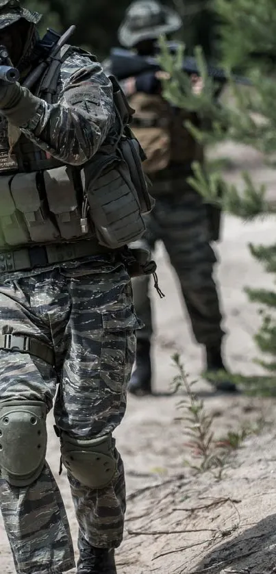 Military team in camouflage moving through a forested area.