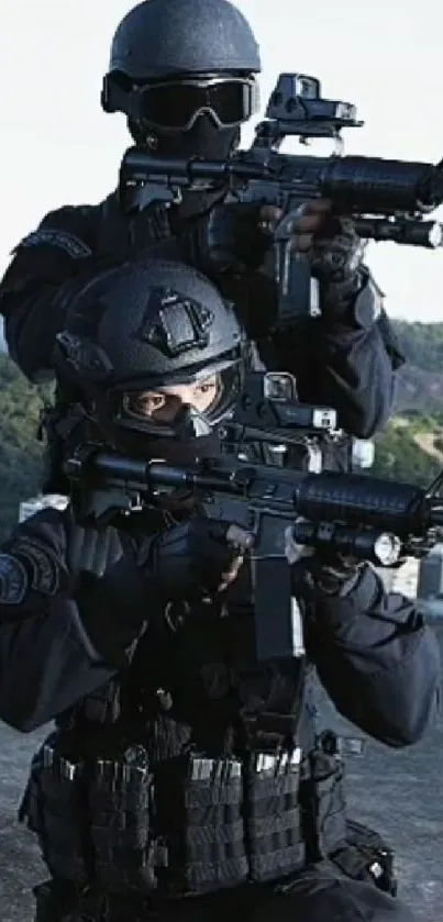 Tactical team in black uniforms with rifles in urban setting.