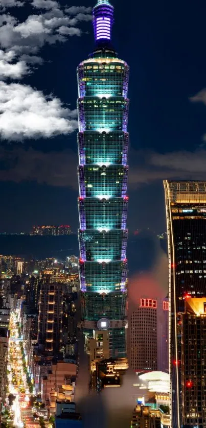 Illuminated Taipei 101 tower against night sky.