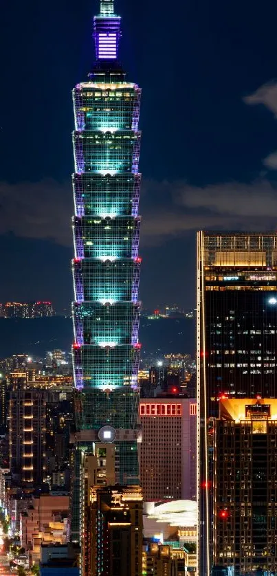 Taipei 101 tower illuminated in vibrant city nightscape.