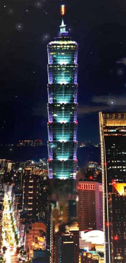 Night view of Taipei 101 glowing against the city skyline.