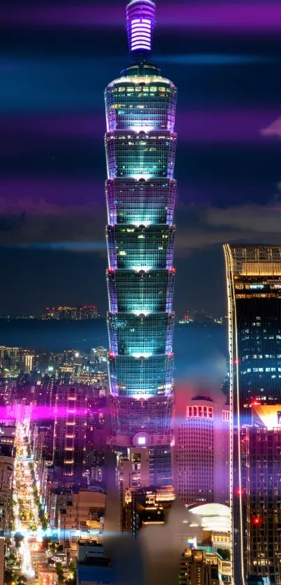 Night view of Taipei 101 skyscraper with colorful city lights.