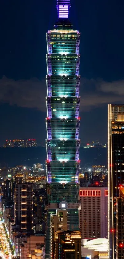 Illuminated Taipei 101 tower at night skyline, city lights glowing.