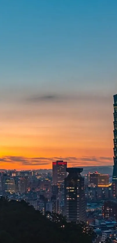 Taipei 101 at sunset with vibrant city skyline.