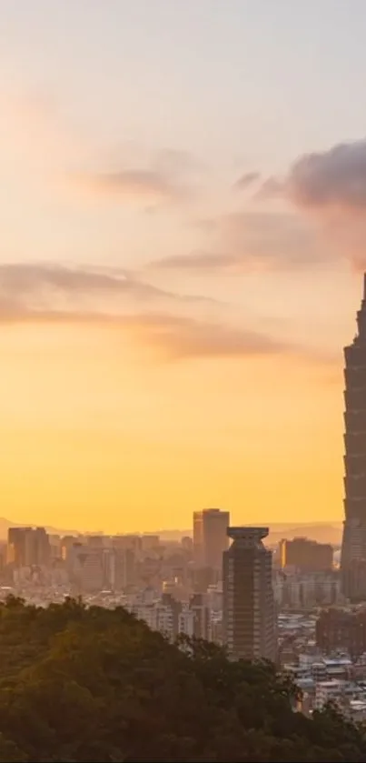 Taipei city skyline at sunset with Taipei 101 silhouetted against an orange sky.