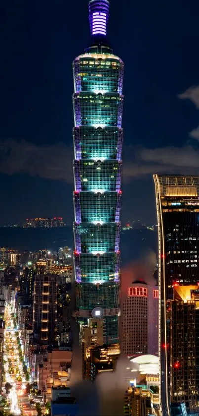 Taipei 101 illuminated at night against city skyline.