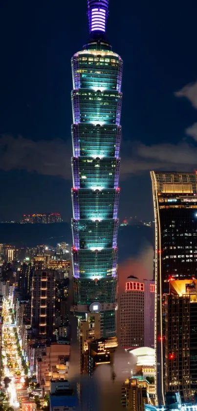 Taipei 101 tower and cityscape at night, featuring illuminated buildings.