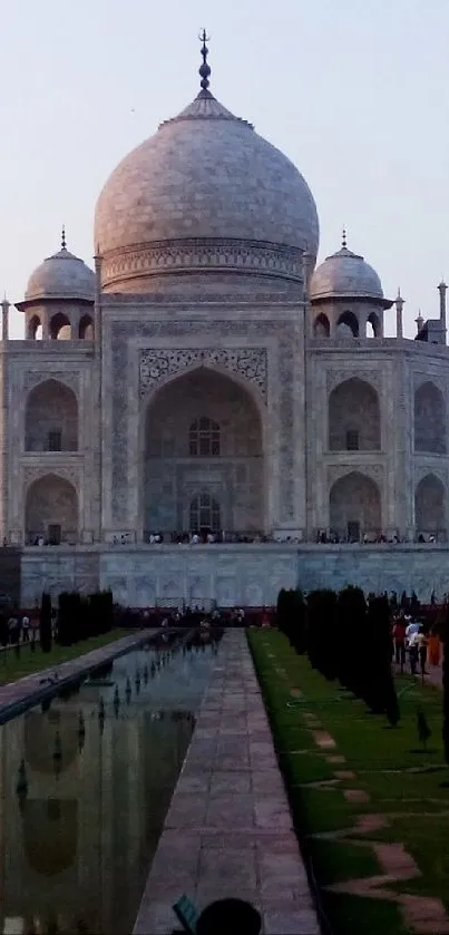 Taj Mahal at dusk with evening sky and reflection.