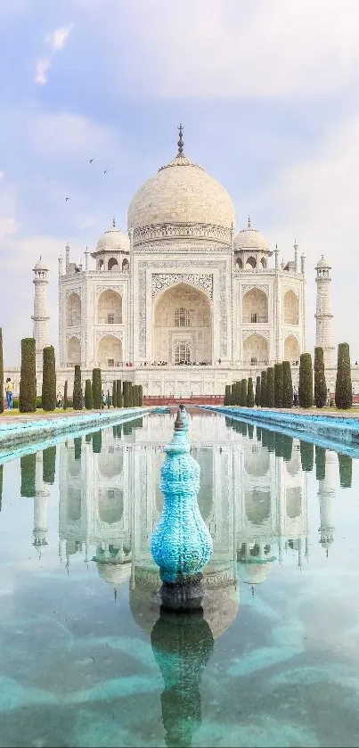 Majestic view of the Taj Mahal with water reflection under a clear sky.