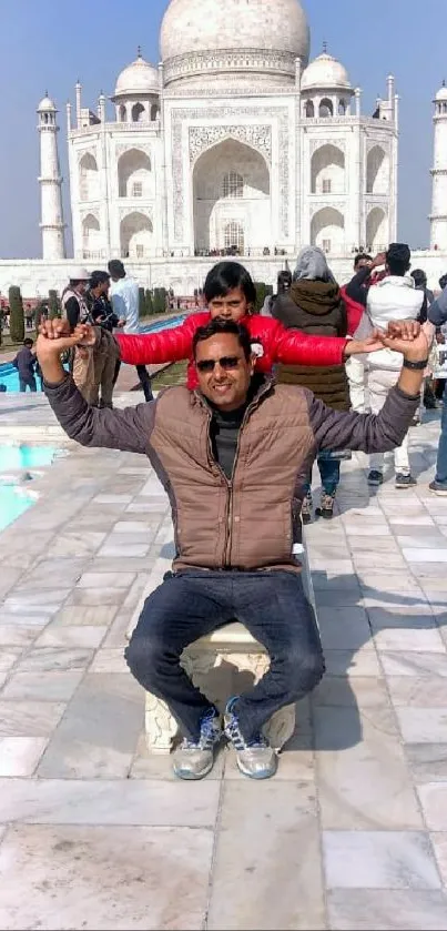 Tourists enjoying at Taj Mahal on a sunny day.