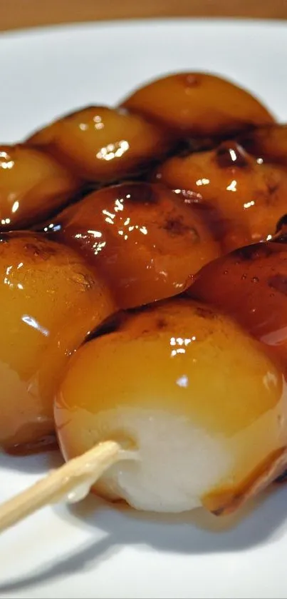 Grilled Japanese dango on a white plate.