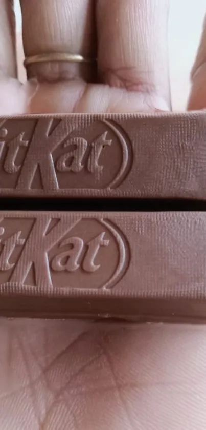 Close-up of a KitKat chocolate bar with detailed texture.