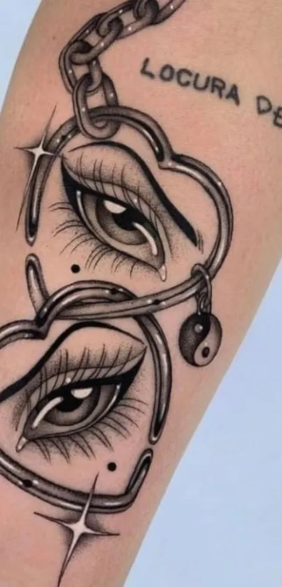 Tattoo of eyes within heart chains on skin background.