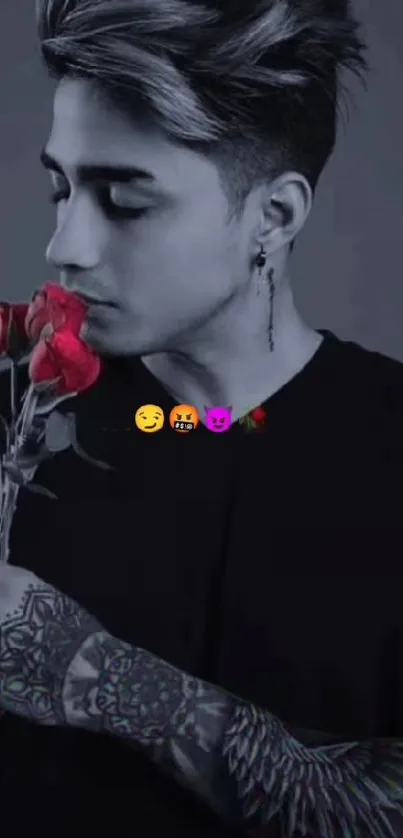 Tattooed man holding red rose in grayscale style with emojis.