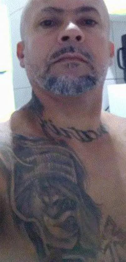 Tattooed male portrait in monochrome tones.