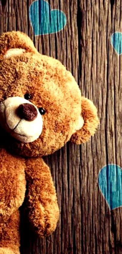 Cute teddy bear with blue hearts on wood background wallpaper.