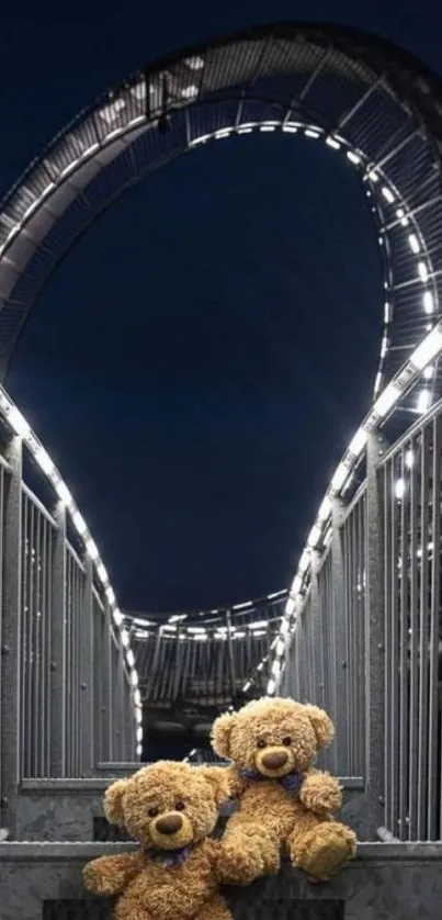 Teddy bears sitting on illuminated bridge at night.