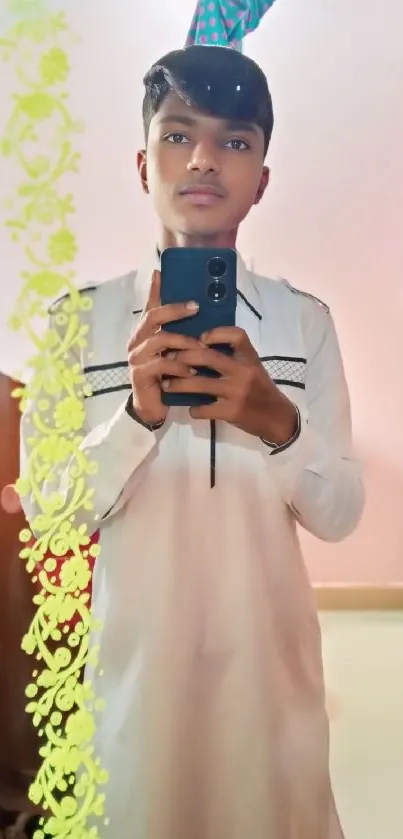 A young man takes a mirror selfie in a stylish room.