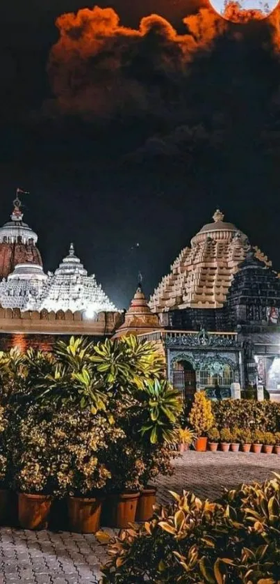 Historic temple under moonlit sky with lush plants.