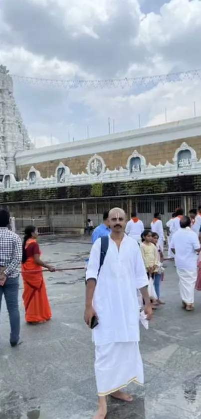 Group visiting a temple in traditional attire.