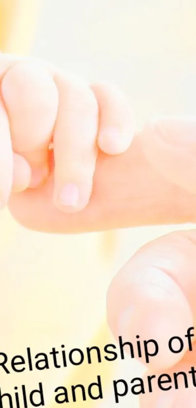 Child's hand gently holding a parent's finger, symbolizing love.