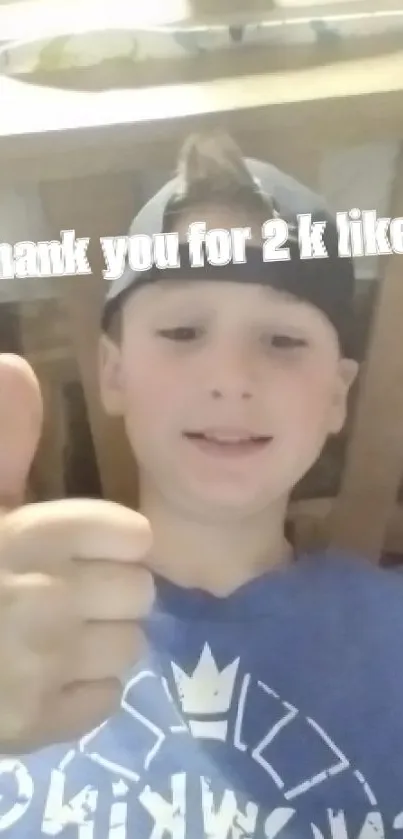 Boy with thumbs-up, thank you for 2k likes text.