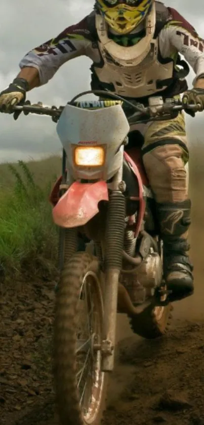 Dirt bike rider navigating muddy trail.