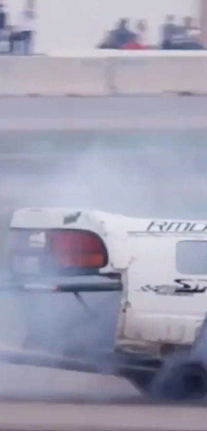 High-speed car drifting on race track, surrounded by smoke.