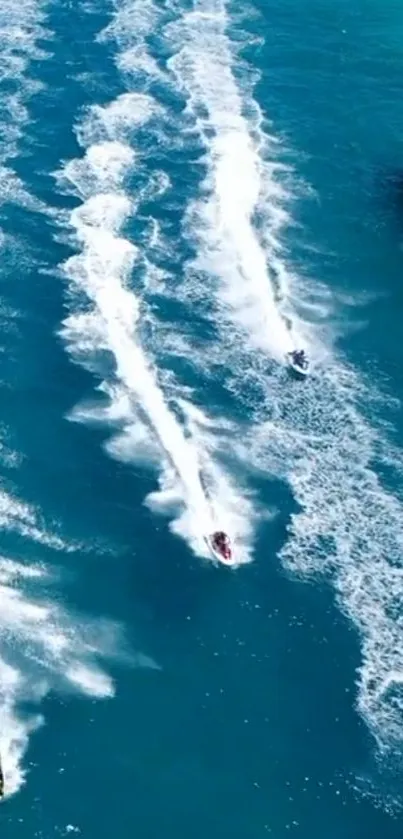 Jet skis racing across vibrant blue water.